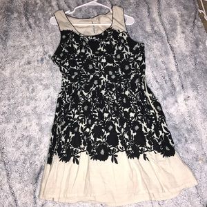 white dress with black flowers on it